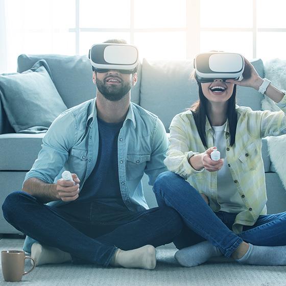 A man and a woman playing with VR headsets