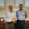 (L-R) William S. Helmly, CEO of Home Telecom and Andy Olsen, Business Development Manager for SCRA