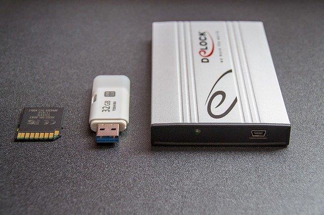 a hard drive, sd card, and a flash drive